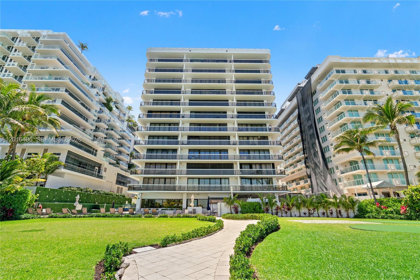 9455 Collins Avenue, Unit 310 Surfside, FL 33154 - Photo 18 of 19 a view of a building with a yard