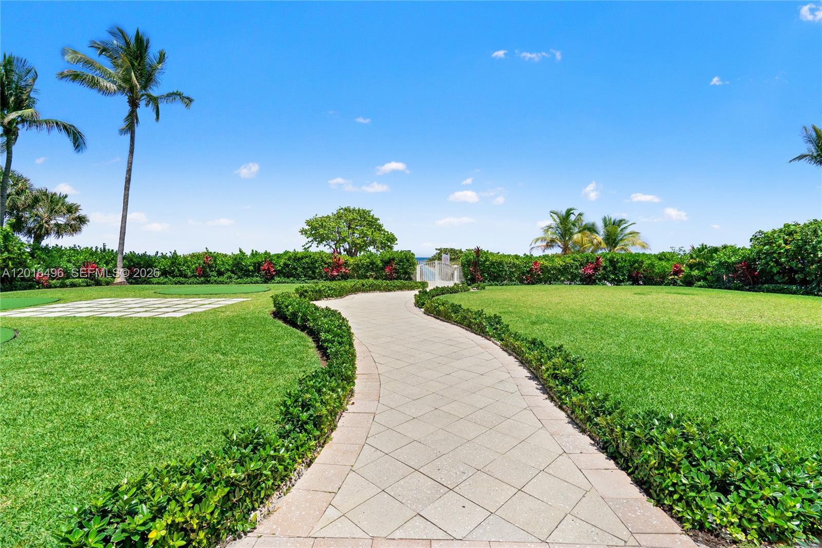 9455 Collins Avenue, Unit 310 Surfside, FL 33154 - Photo 4 of 19 a view of a garden with a building in the background