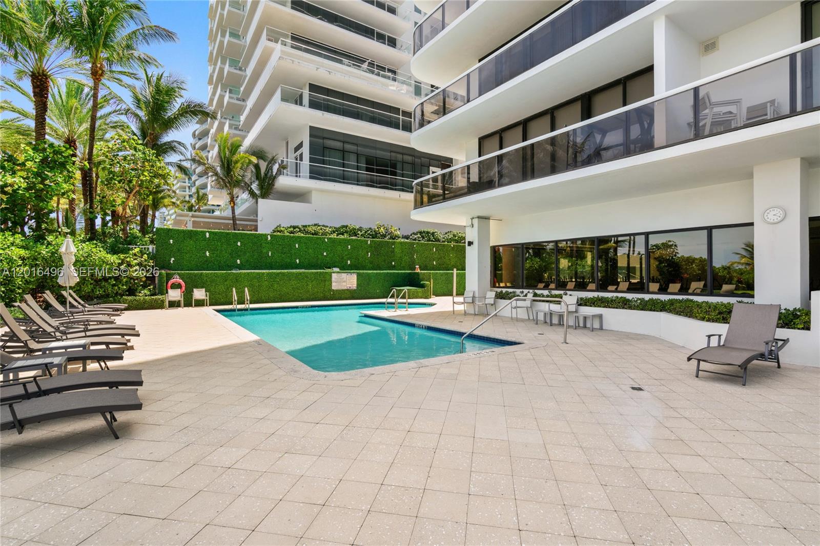 9455 Collins Avenue, Unit 310 Surfside, FL 33154 - Photo 7 of 19 a view of a patio with a backyard