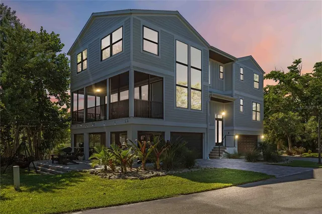 a front view of a building with a yard