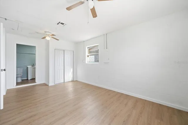 a view of an empty room with a window