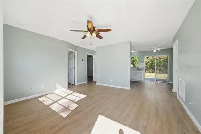 a view of livingroom with hardwood floor and a ceiling fan
