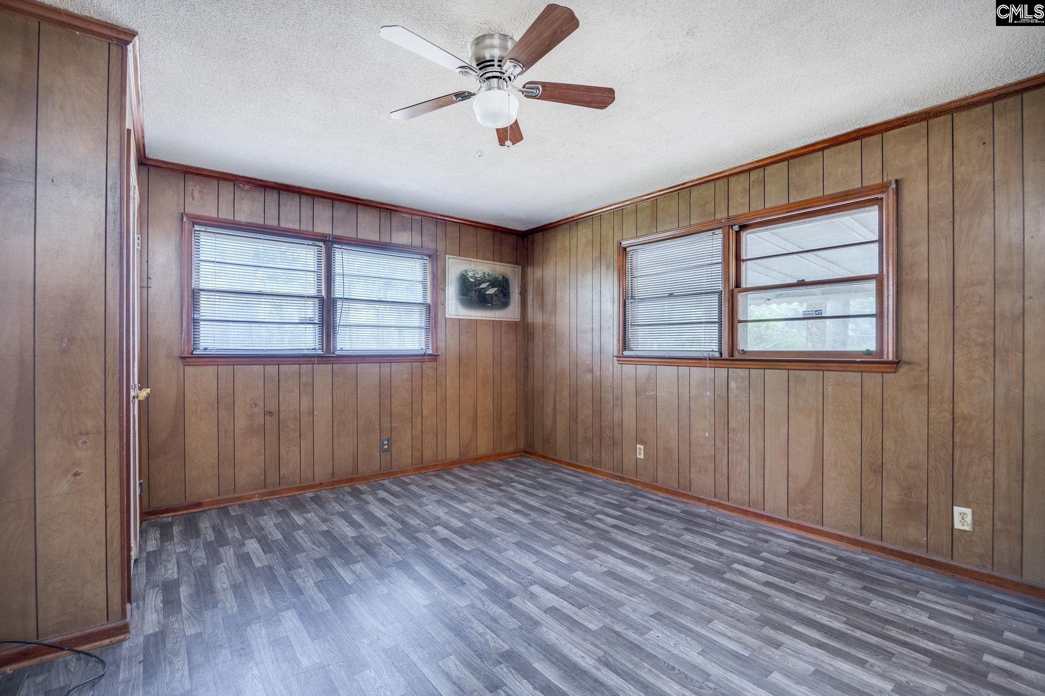 5666 Middleton Court Columbia, SC 29203 - Photo 22 of 42 wooden floor in an empty room with a window