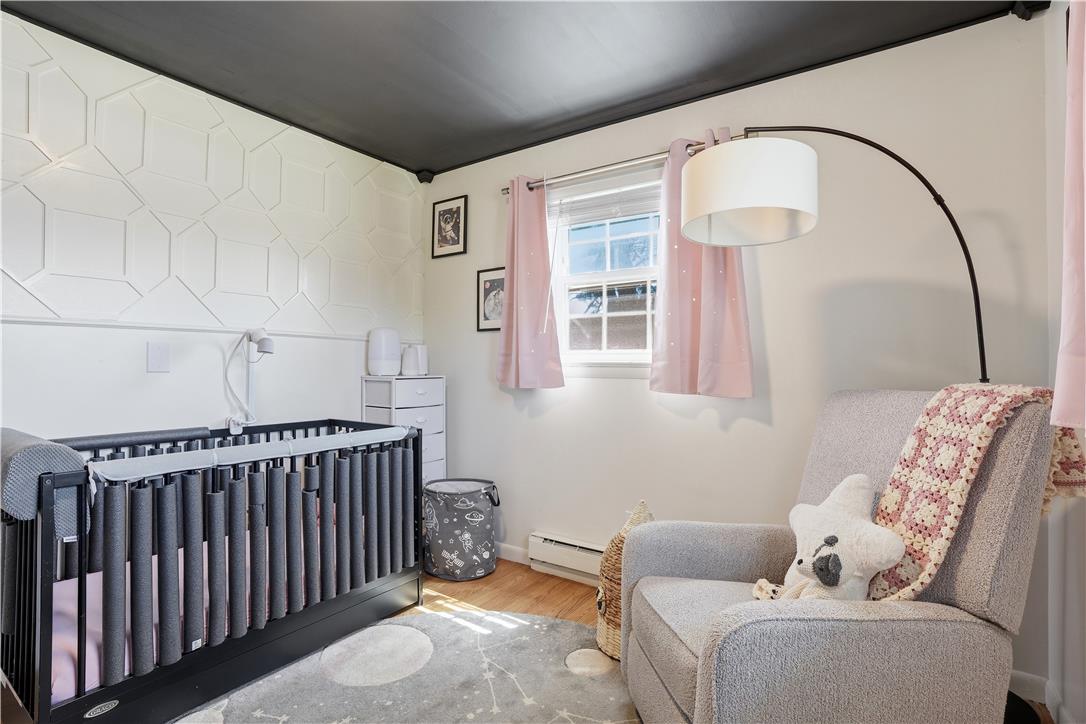 2918 Keystone Street Bethlehem, PA 18020 - Photo 19 of 54 Hardwood flooring and decorative wall paneling complement this cozy nursery with ample natural light.