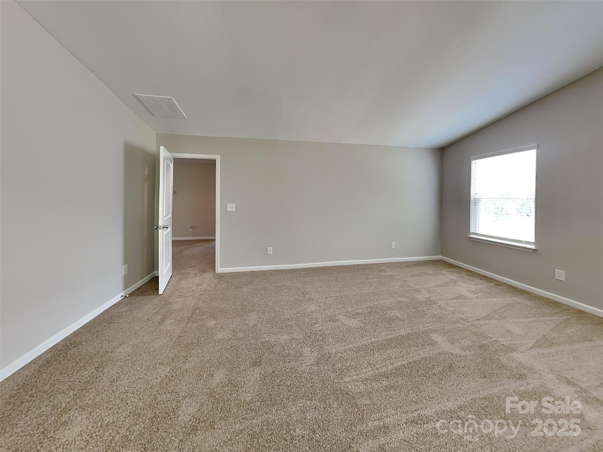 608 Hunley Street Monroe, NC 28112 - Photo 11 of 21 an empty room with windows and closet