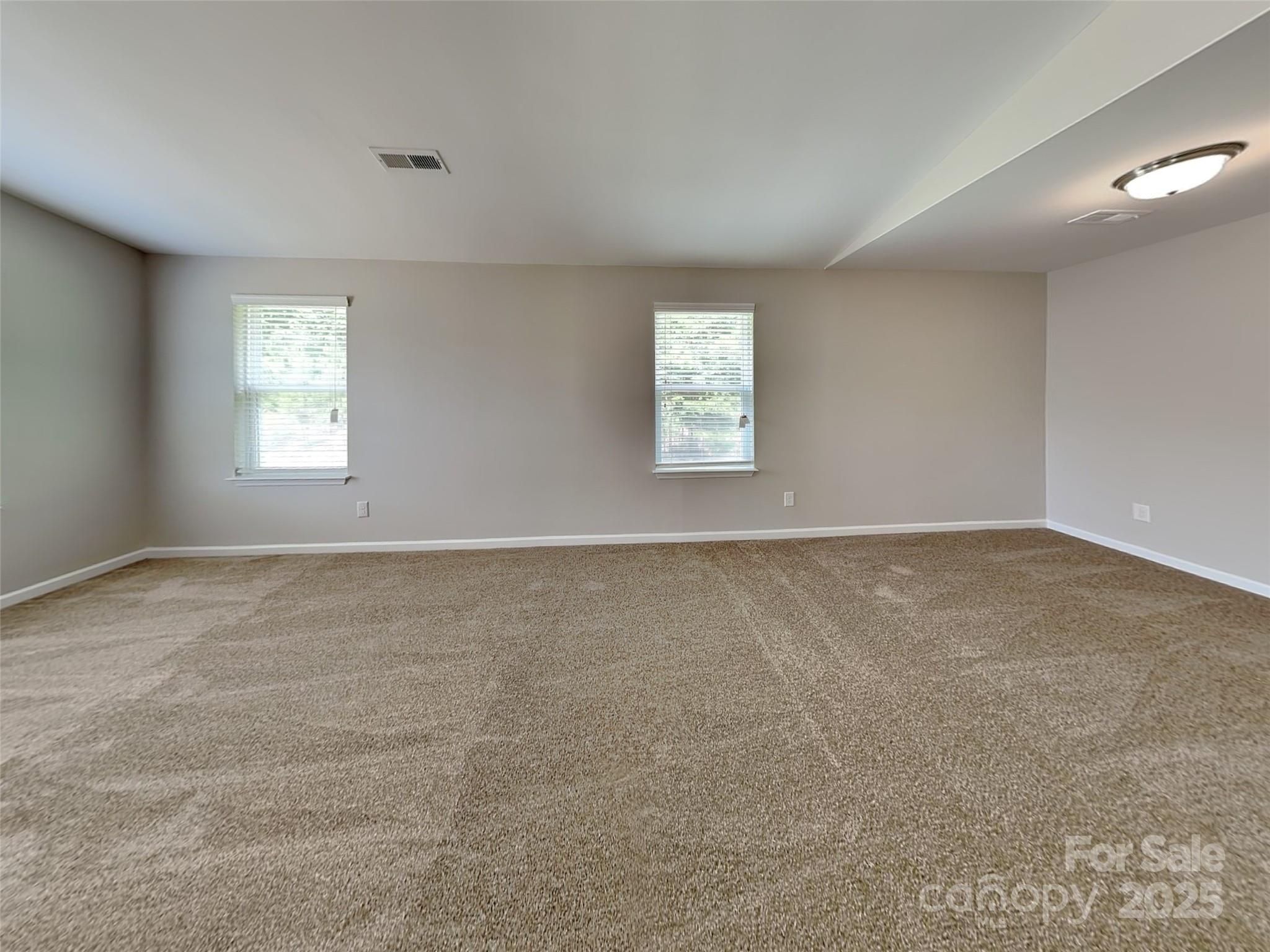 608 Hunley Street Monroe, NC 28112 - Photo 12 of 21 an empty room with a window