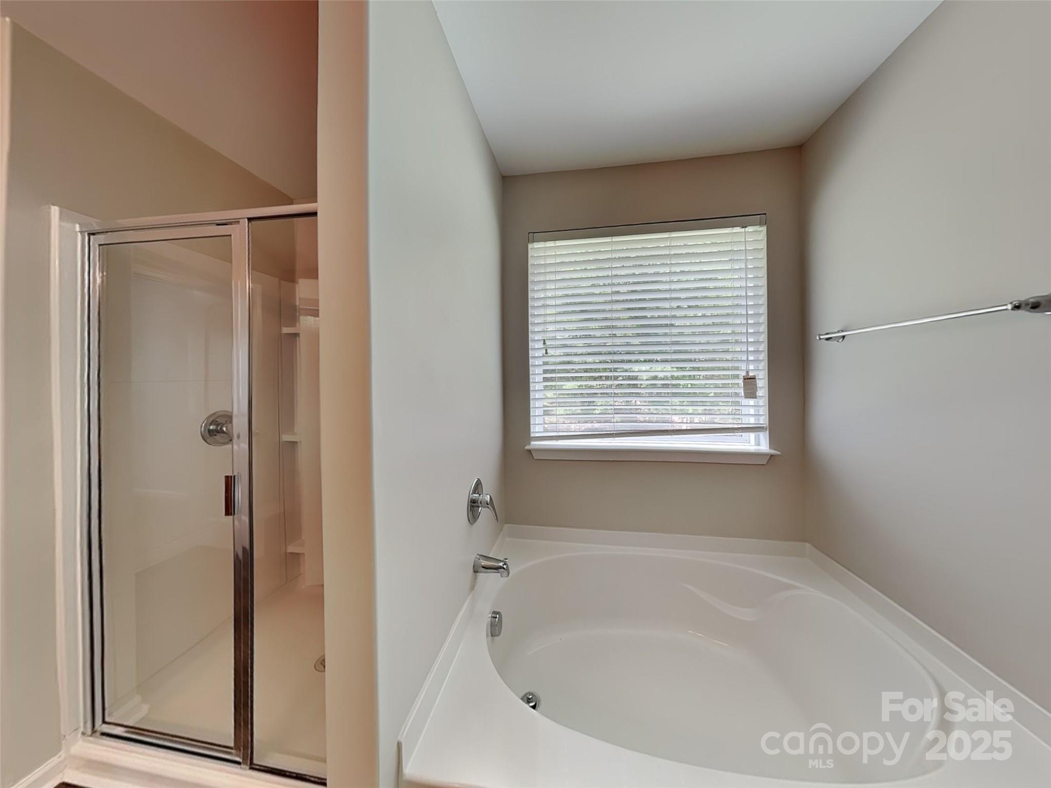 608 Hunley Street Monroe, NC 28112 - Photo 14 of 21 a white bath tub sitting next to a window