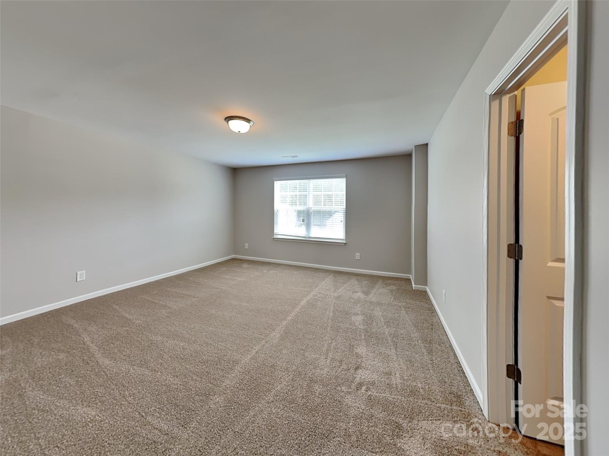 608 Hunley Street Monroe, NC 28112 - Photo 15 of 21 a view of an empty room and window