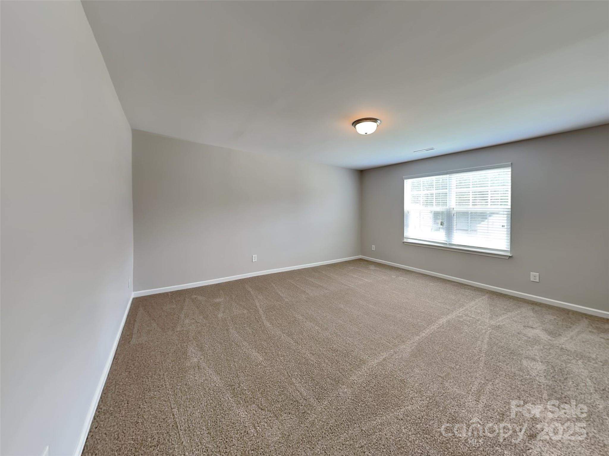 608 Hunley Street Monroe, NC 28112 - Photo 16 of 21 an empty room with a window