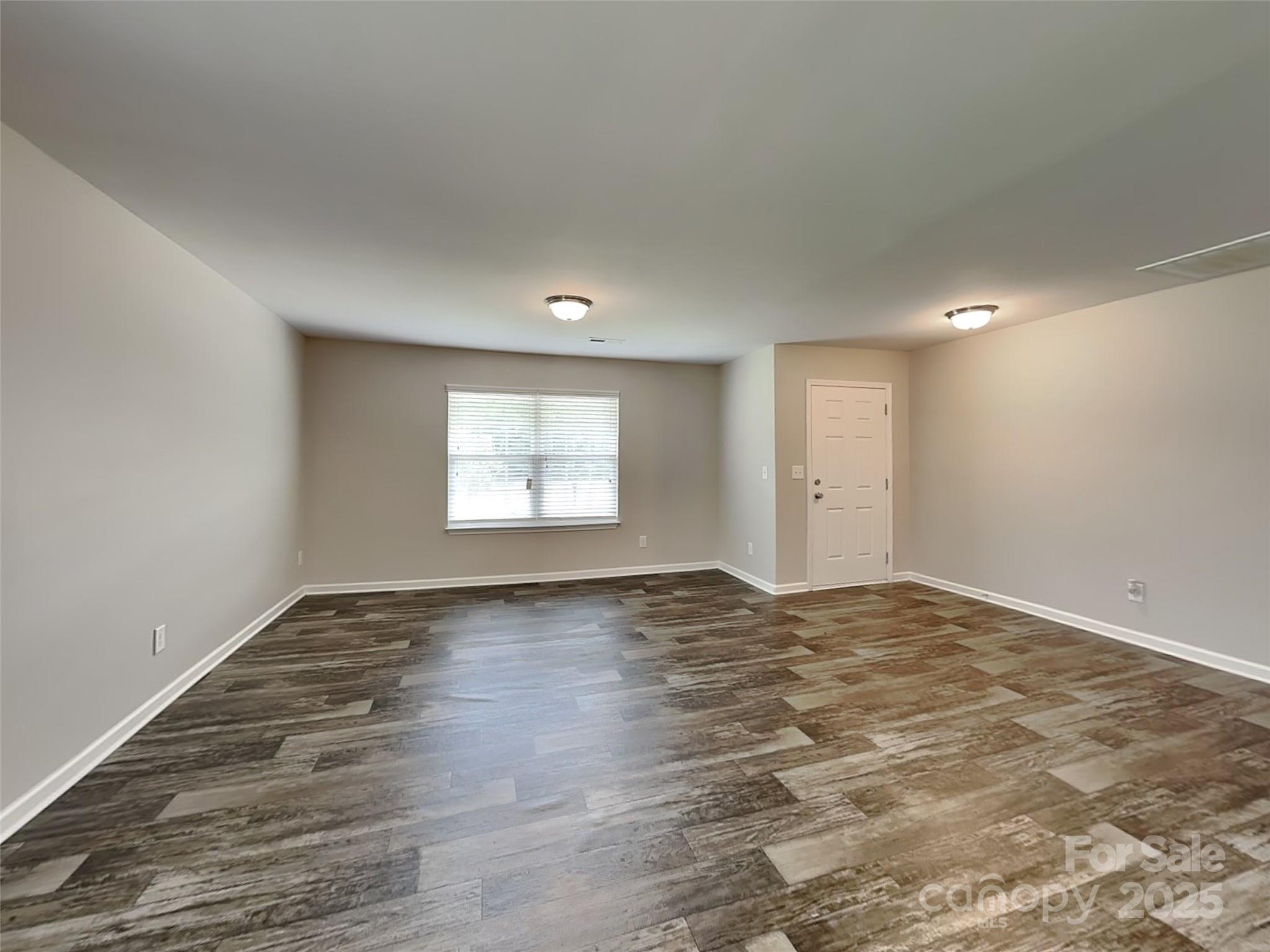 608 Hunley Street Monroe, NC 28112 - Photo 4 of 21 a view of an empty room and window
