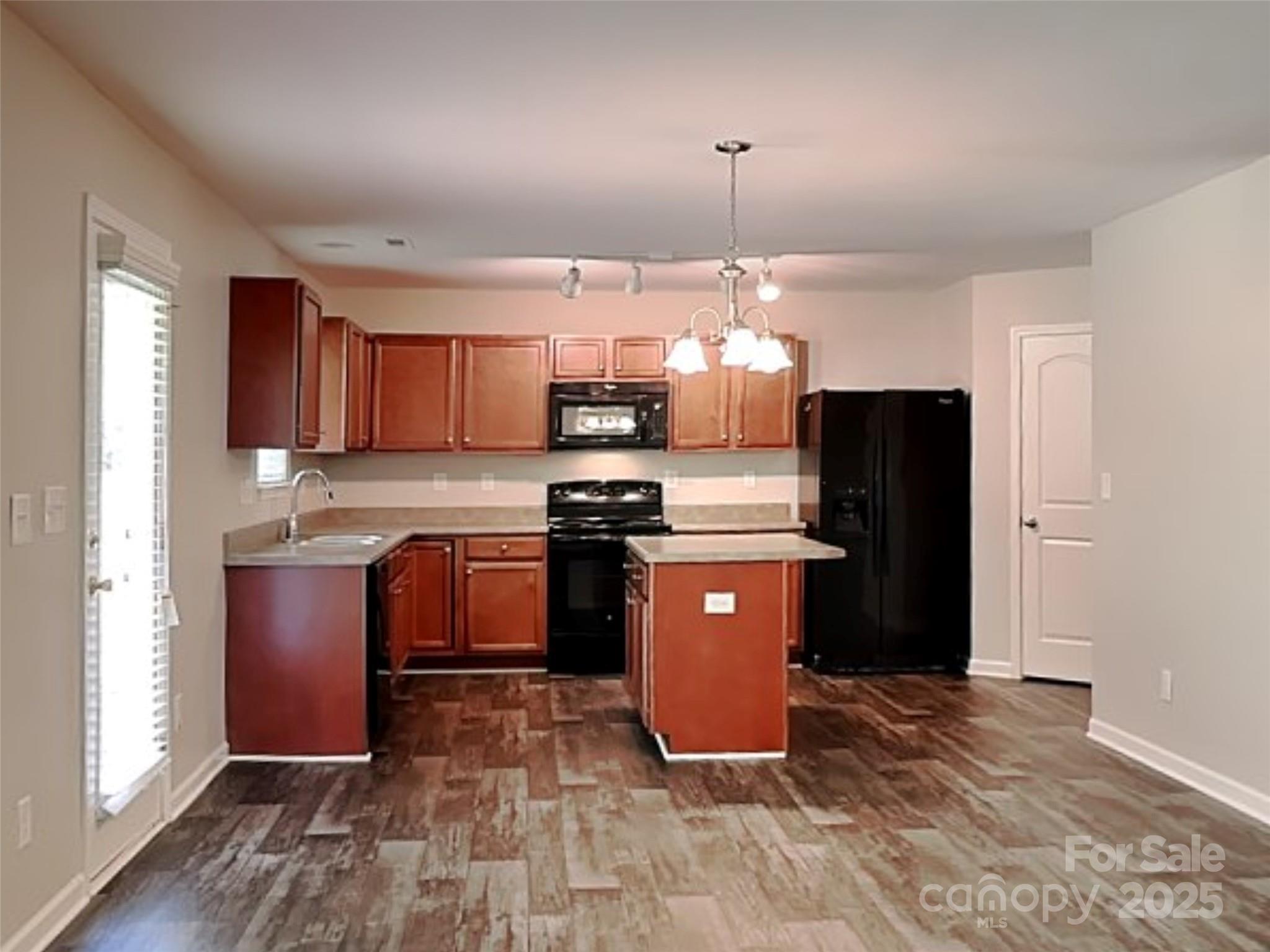 608 Hunley Street Monroe, NC 28112 - Photo 5 of 21 a kitchen with stainless steel appliances granite countertop a refrigerator a stove a sink and a microwave