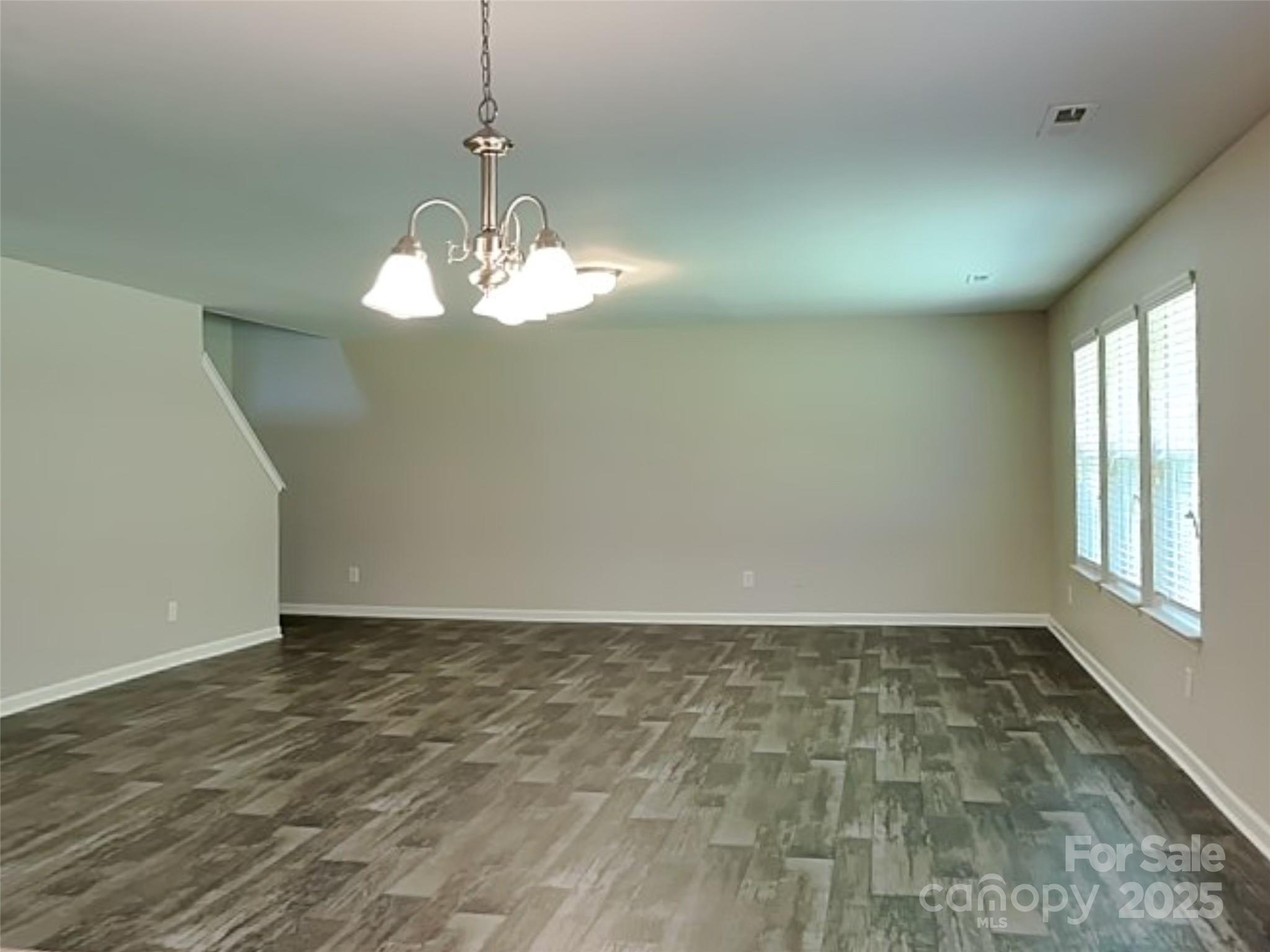 608 Hunley Street Monroe, NC 28112 - Photo 6 of 21 a view of an empty room with a window