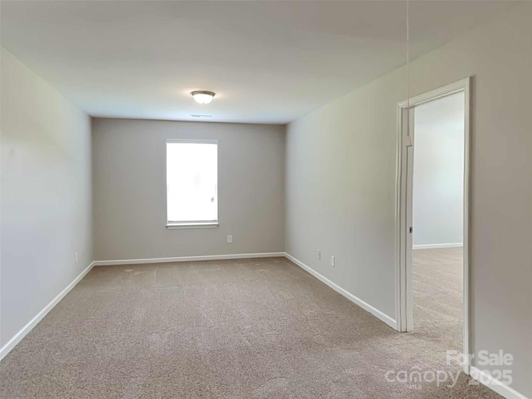 608 Hunley Street Monroe, NC 28112 - Photo 9 of 21 an empty room with a window