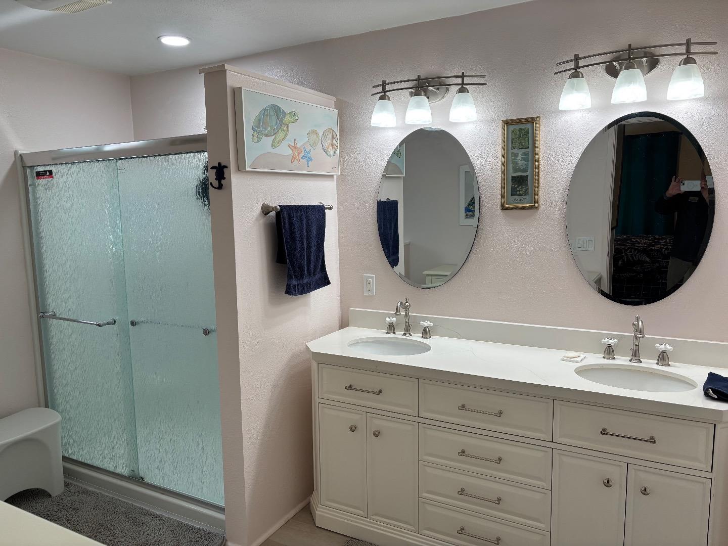 809 Maher Road Salinas, CA 93907 - Photo 11 of 17 a bathroom with a double vanity sink and a mirror