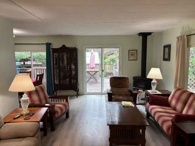 a living room with furniture and a lamp
