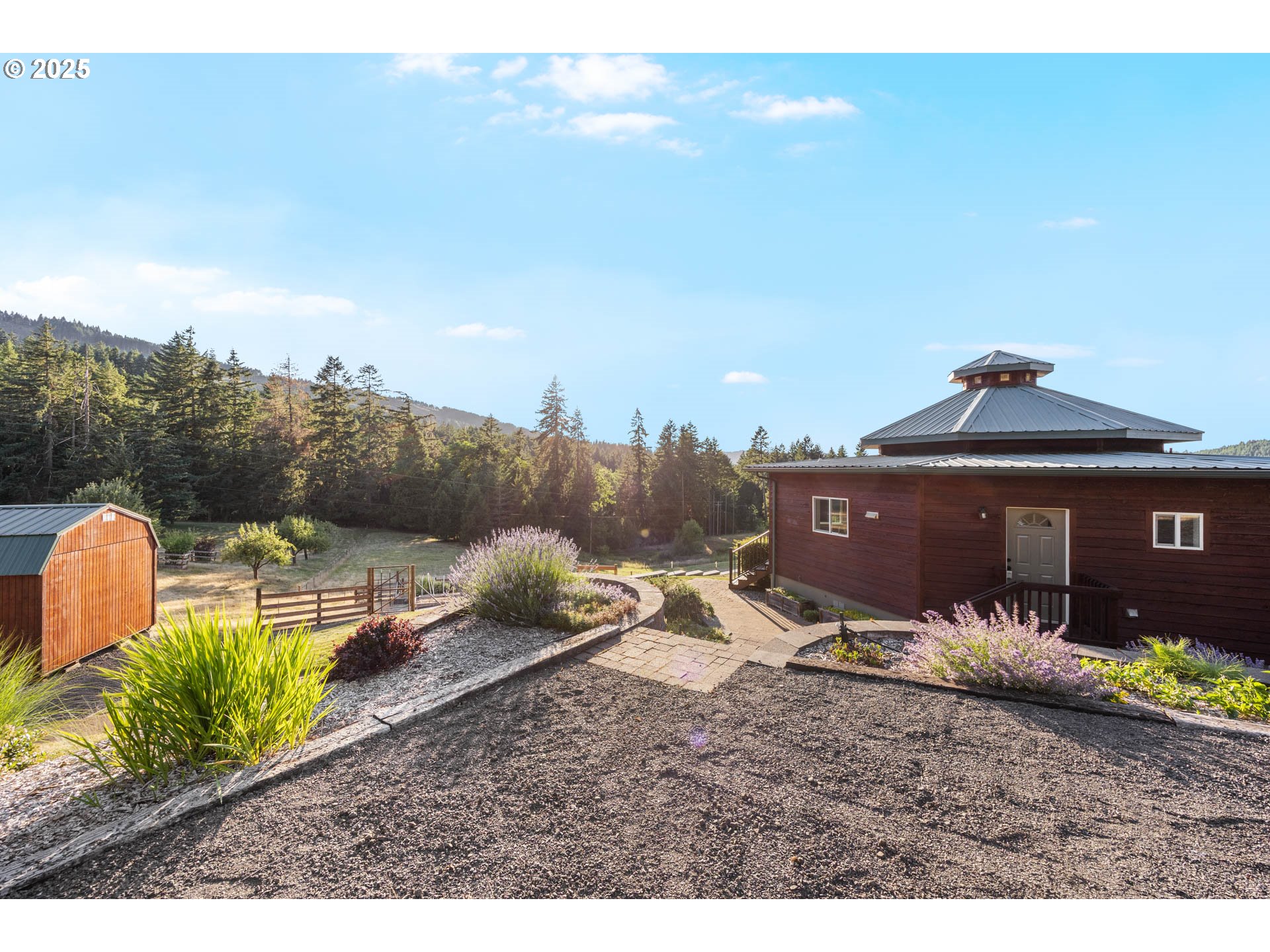 6477 Elkhead Road Yoncalla, OR 97499 - Photo 22 of 35 a view of a house with a yard