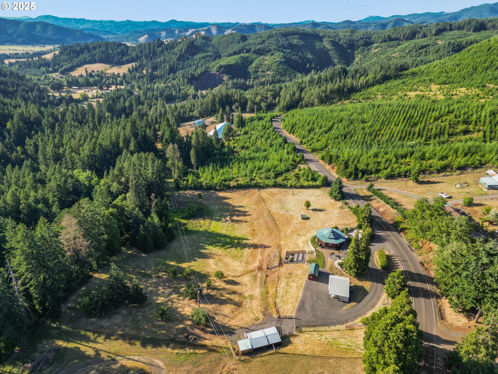 6477 Elkhead Road Yoncalla, OR 97499 - Photo 31 of 35 an aerial view of residential houses with outdoor space and trees
