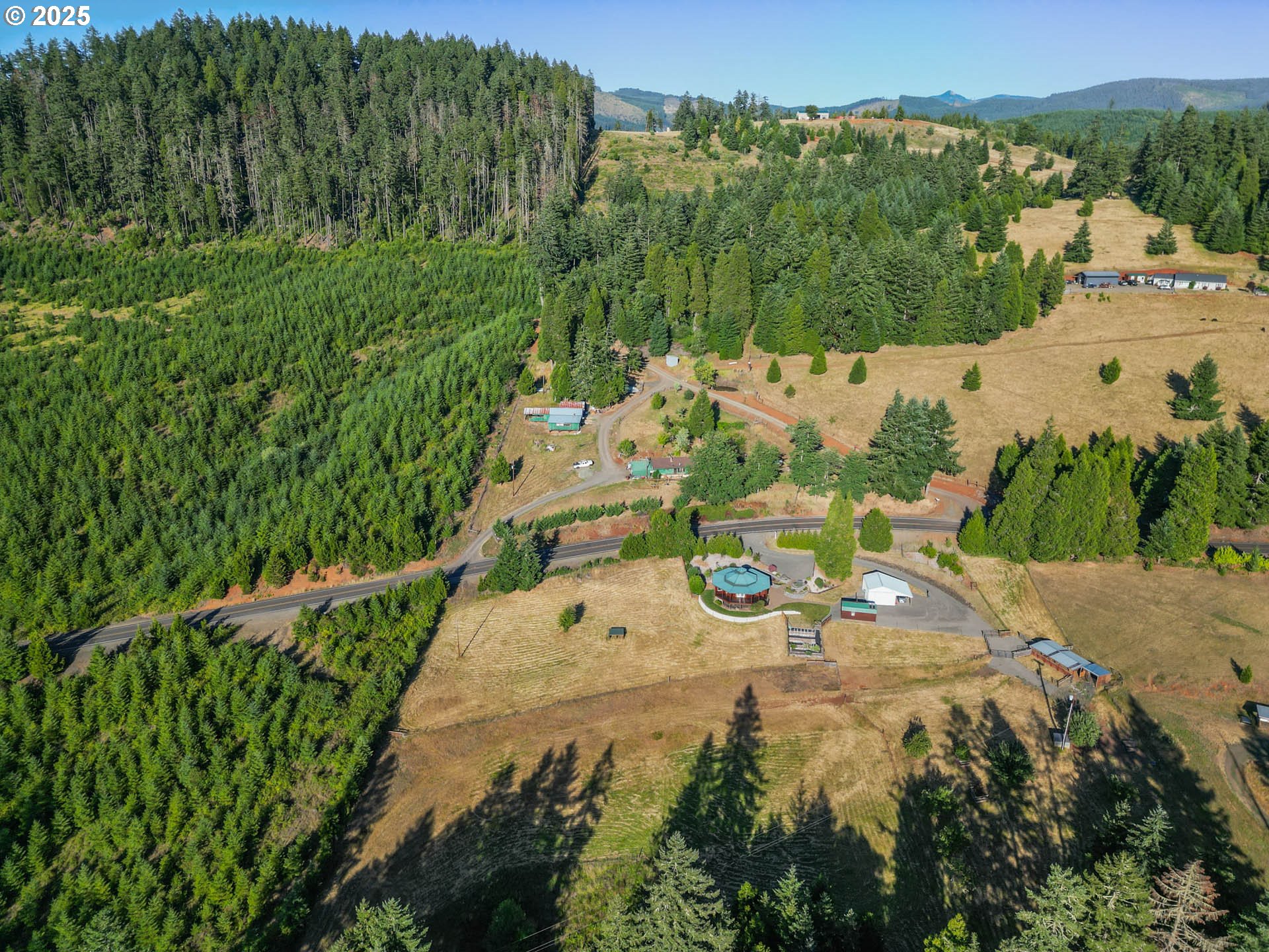6477 Elkhead Road Yoncalla, OR 97499 - Photo 32 of 35 a view of a table and chairs in the garden