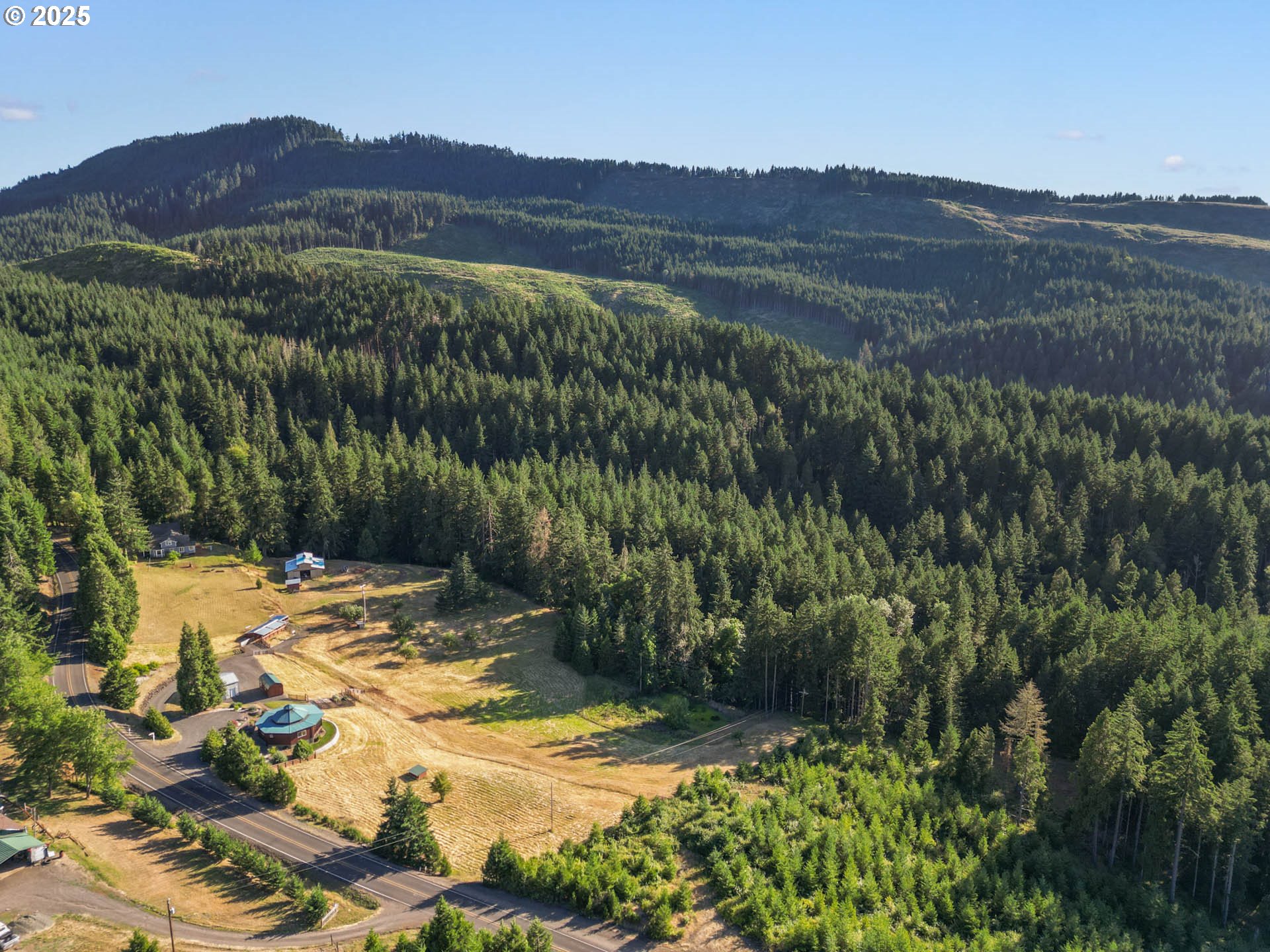 6477 Elkhead Road Yoncalla, OR 97499 - Photo 34 of 35 a view of a lush green hillside and houses