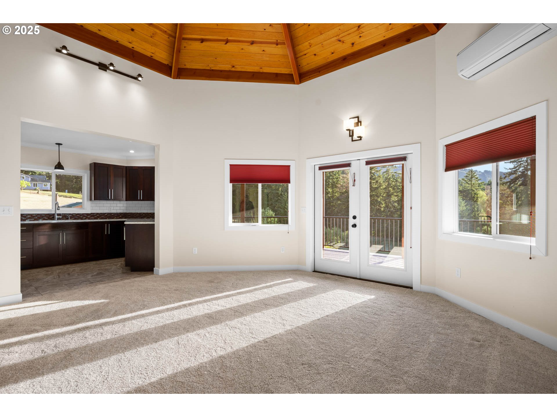 6477 Elkhead Road Yoncalla, OR 97499 - Photo 7 of 35 a view of an empty room with a window and kitchen view