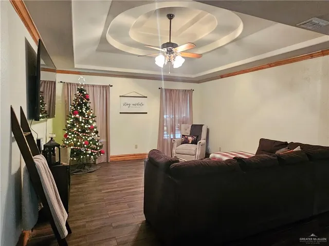 a bedroom with furniture and a chandelier