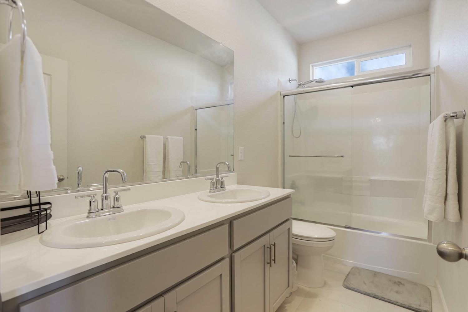 6949 Foraker Drive Stockton, CA 95219 - Photo 24 of 34 a bathroom with a sink toilet and shower