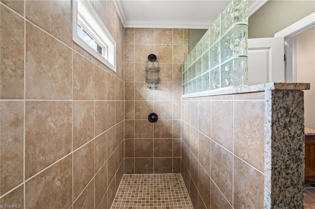 6202 Herons Nest Court Oak Ridge, NC 27310 - Photo 22 of 50 Tile shower in main level bathroom