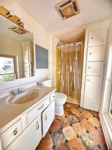 a view of a house with a big yard