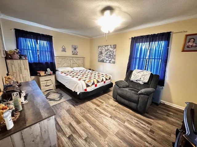 a bedroom with two beds and a dresser