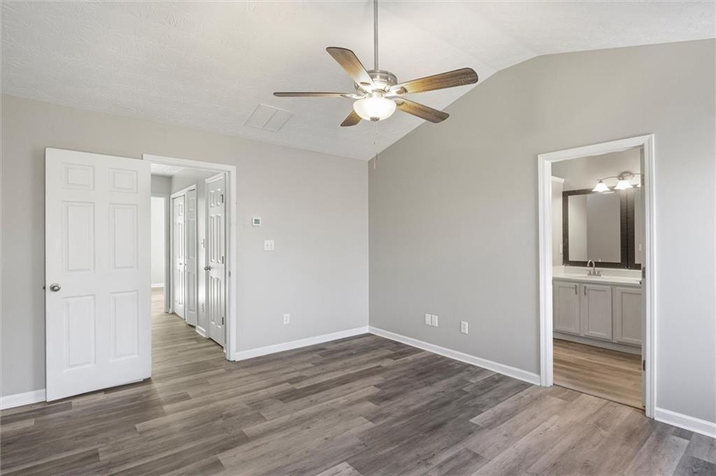 5667 Cascade Run Atlanta, GA 30336 - Photo 16 of 31 wooden floor in an empty room with a mirror