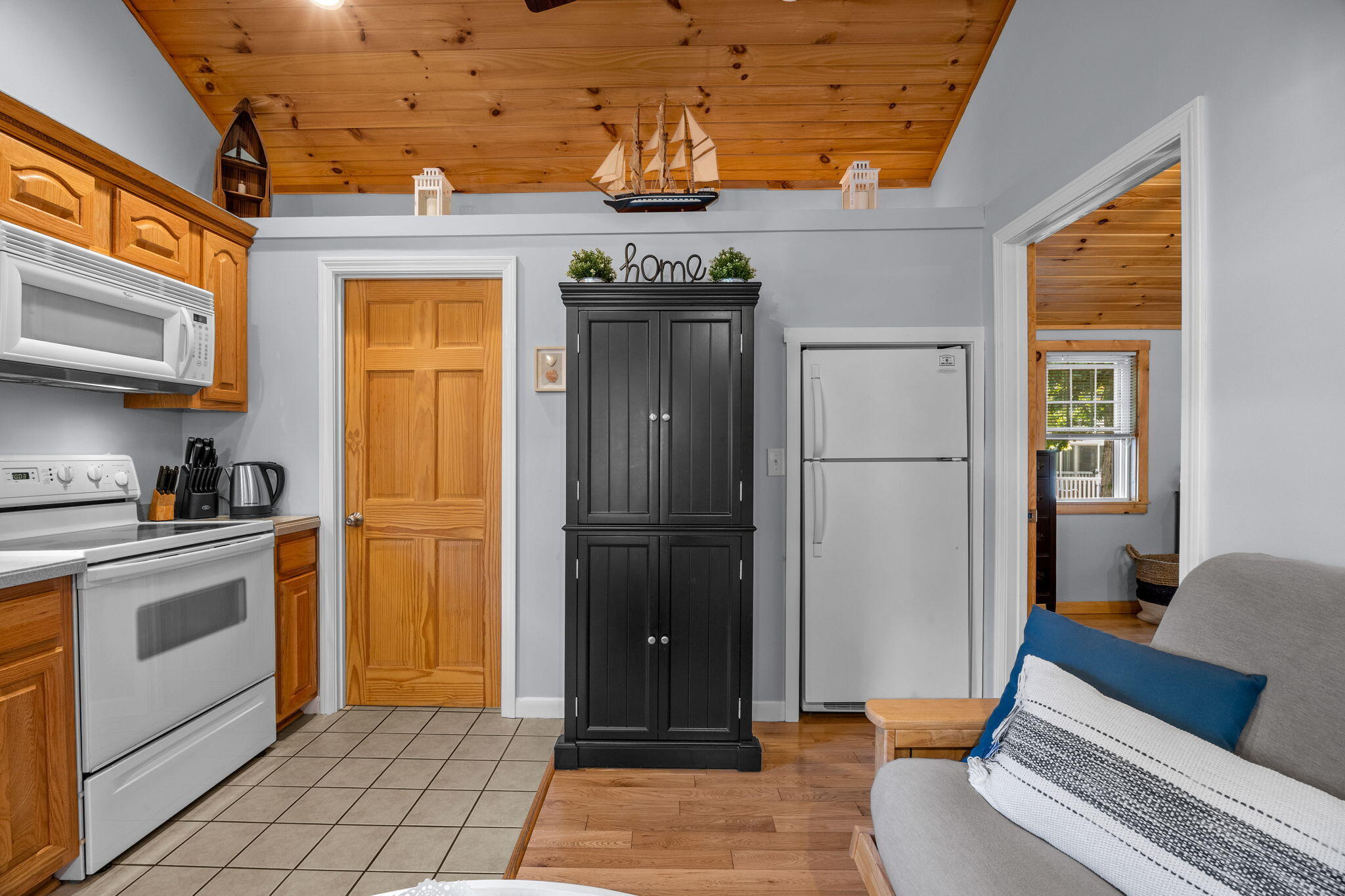 2032 State Hwy Route, Unit F/ (6) Wellfleet, MA 02667 - Photo 3 of 37 a kitchen with stainless steel appliances granite countertop a refrigerator and a stove