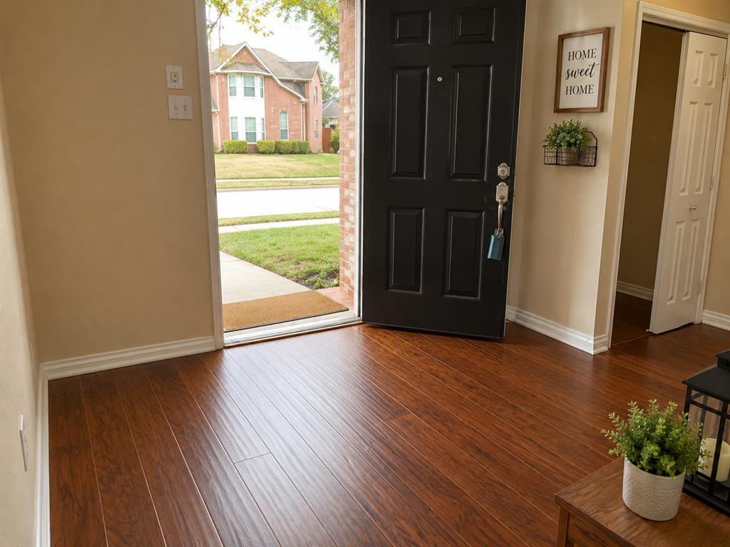 7972 Shield Road Frisco, TX 75035 - Photo 2 of 16 Ai modified- Step down from foyer into hall and living area