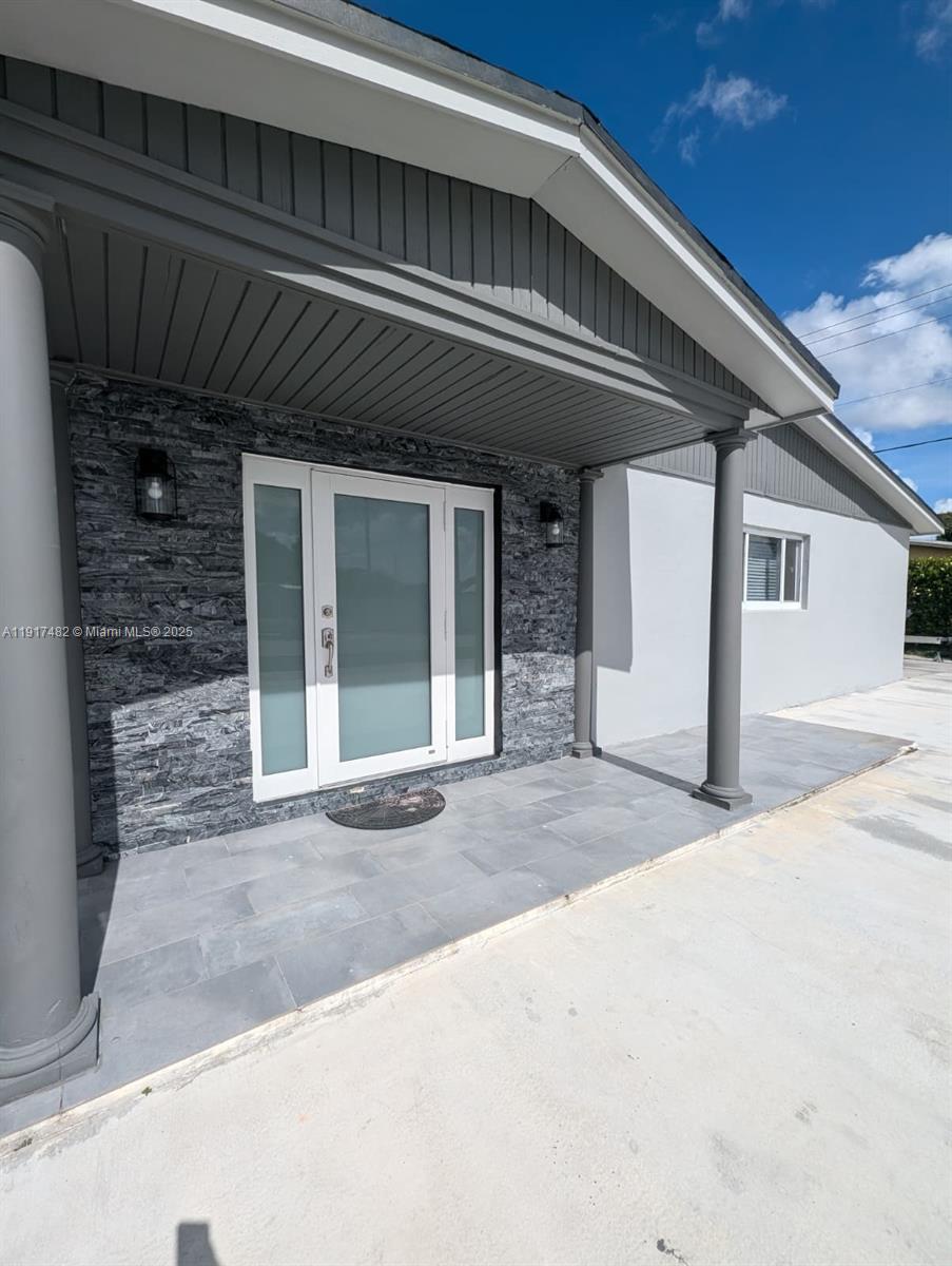 20830 Northwest 34th Avenue, Unit A Miami Gardens, FL 33056 - Photo 5 of 5 a view of a house with a parking space