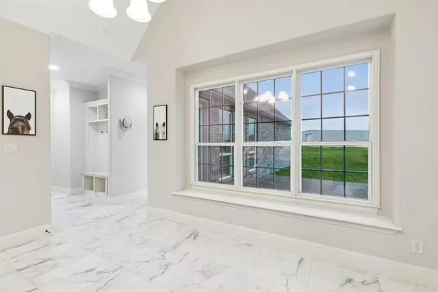 a kitchen that has a sink and a stove in it