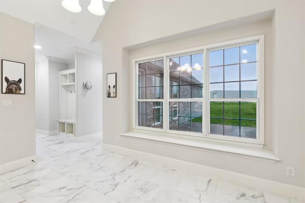1405 Gateway Boulevard Forney, TX 75126 - Photo 10 of 32 a view of an empty room with a window