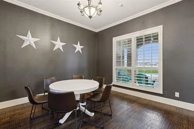 a kitchen with granite countertop a sink a stove and cabinets