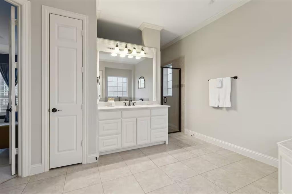 1405 Gateway Boulevard Forney, TX 75126 - Photo 17 of 32 a bathroom with a sink vanity and mirror