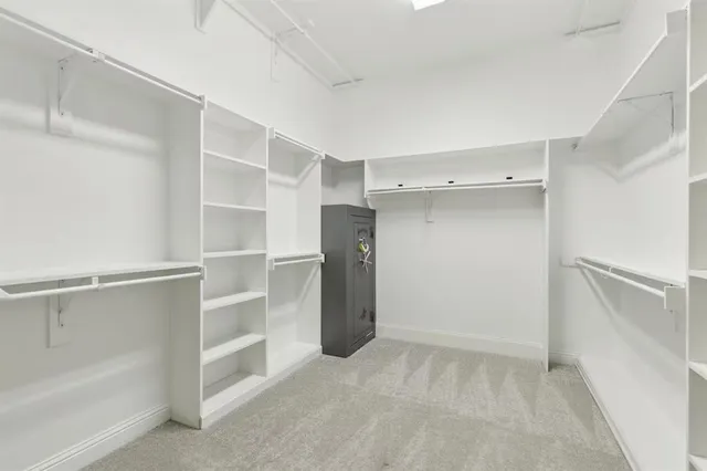 a bathroom with a bathtub and a window