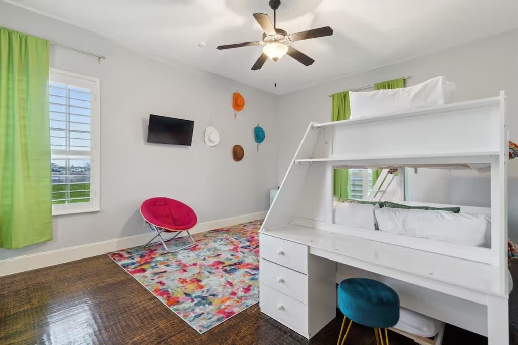 1405 Gateway Boulevard Forney, TX 75126 - Photo 25 of 32 a living room with furniture and a baby crib