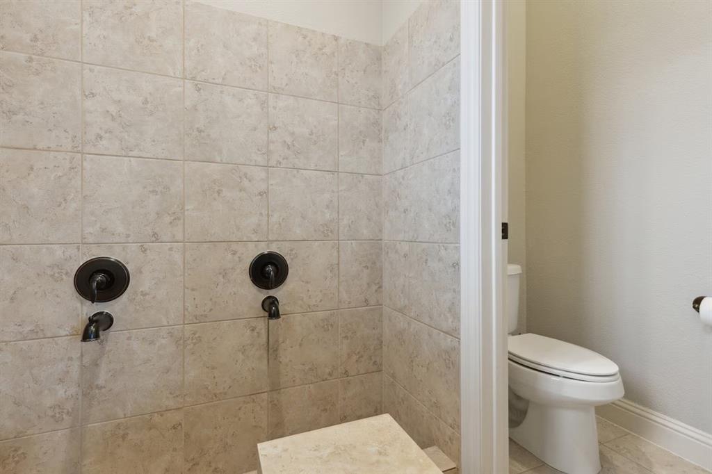1405 Gateway Boulevard Forney, TX 75126 - Photo 28 of 32 a bathroom with a toilet