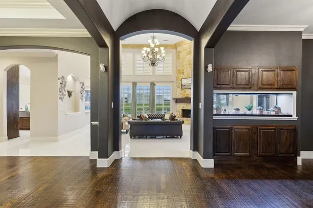 a view of an entryway with wooden floor