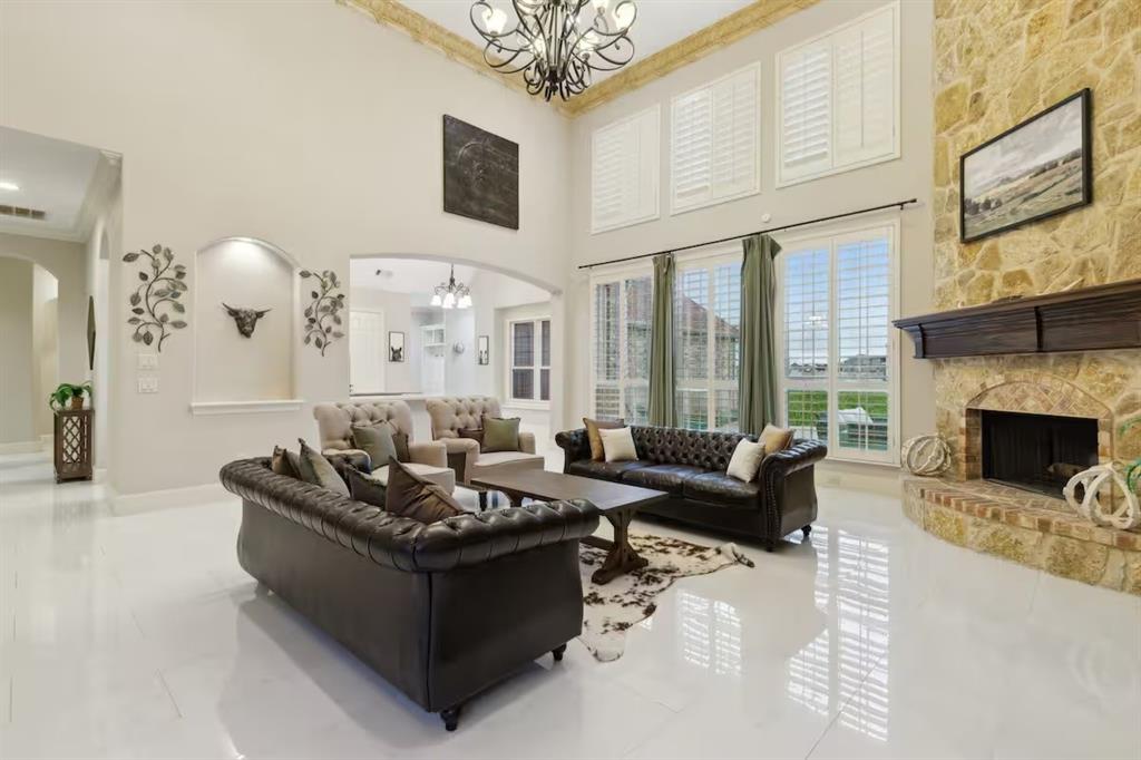 1405 Gateway Boulevard Forney, TX 75126 - Photo 8 of 32 a living room with furniture fireplace and a large window