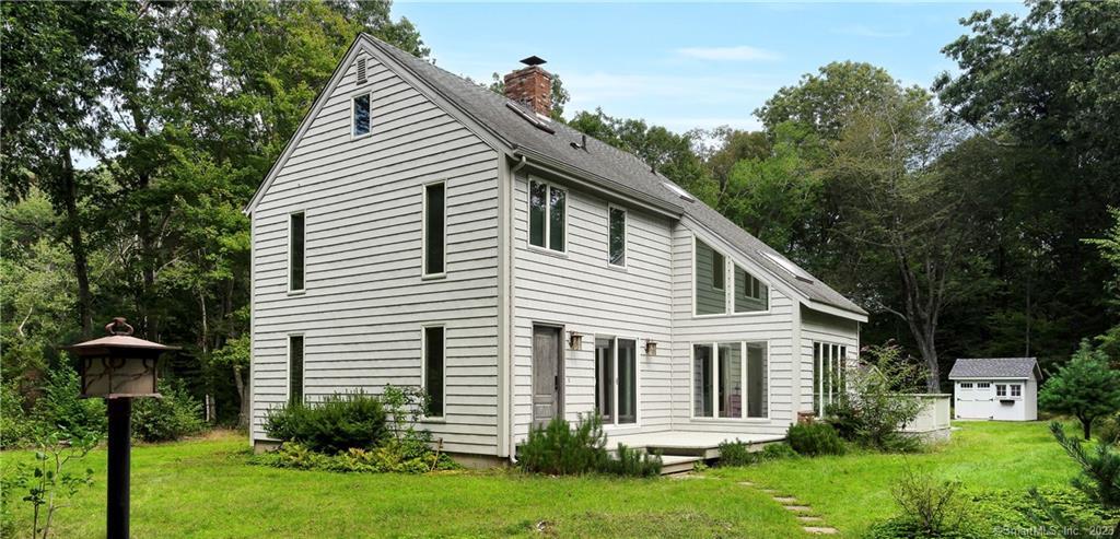 35 Grouse Lane Madison, CT 06443 - Photo 1 of 1 a front view of a house with garden
