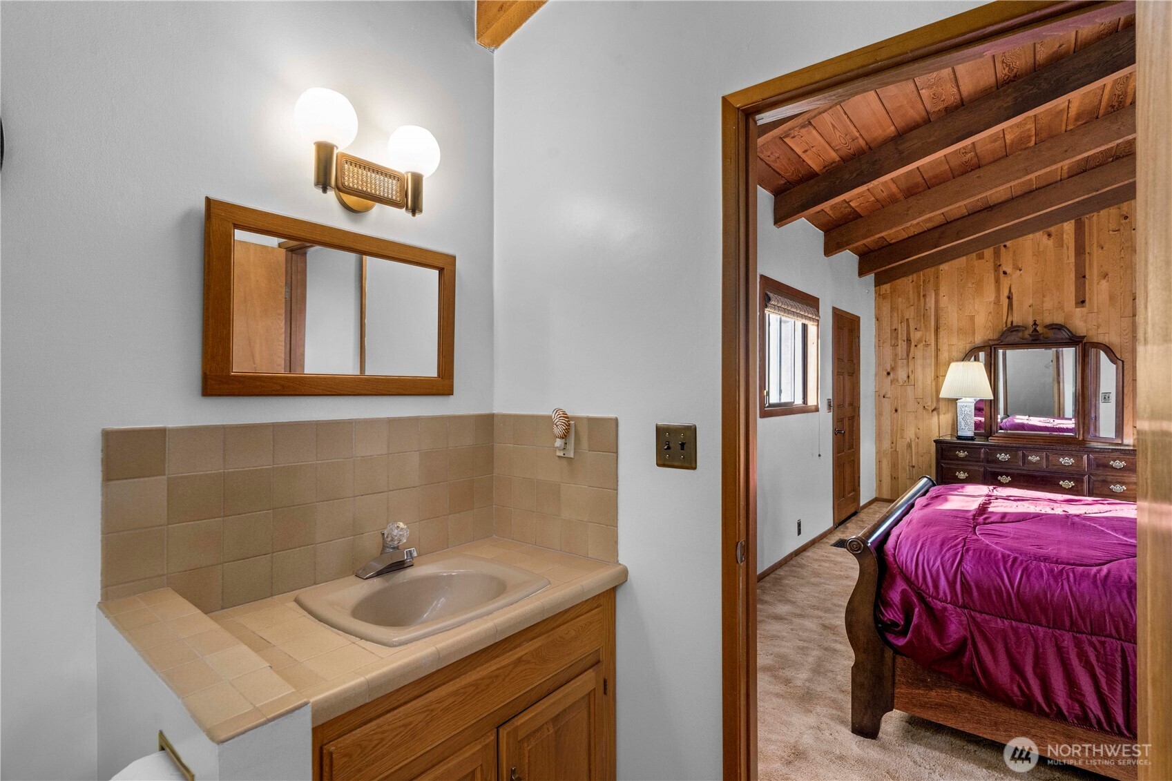 491 Bachelor Road Sequim, WA 98382 - Photo 17 of 39 a en suite bathroom with a sink and a mirror