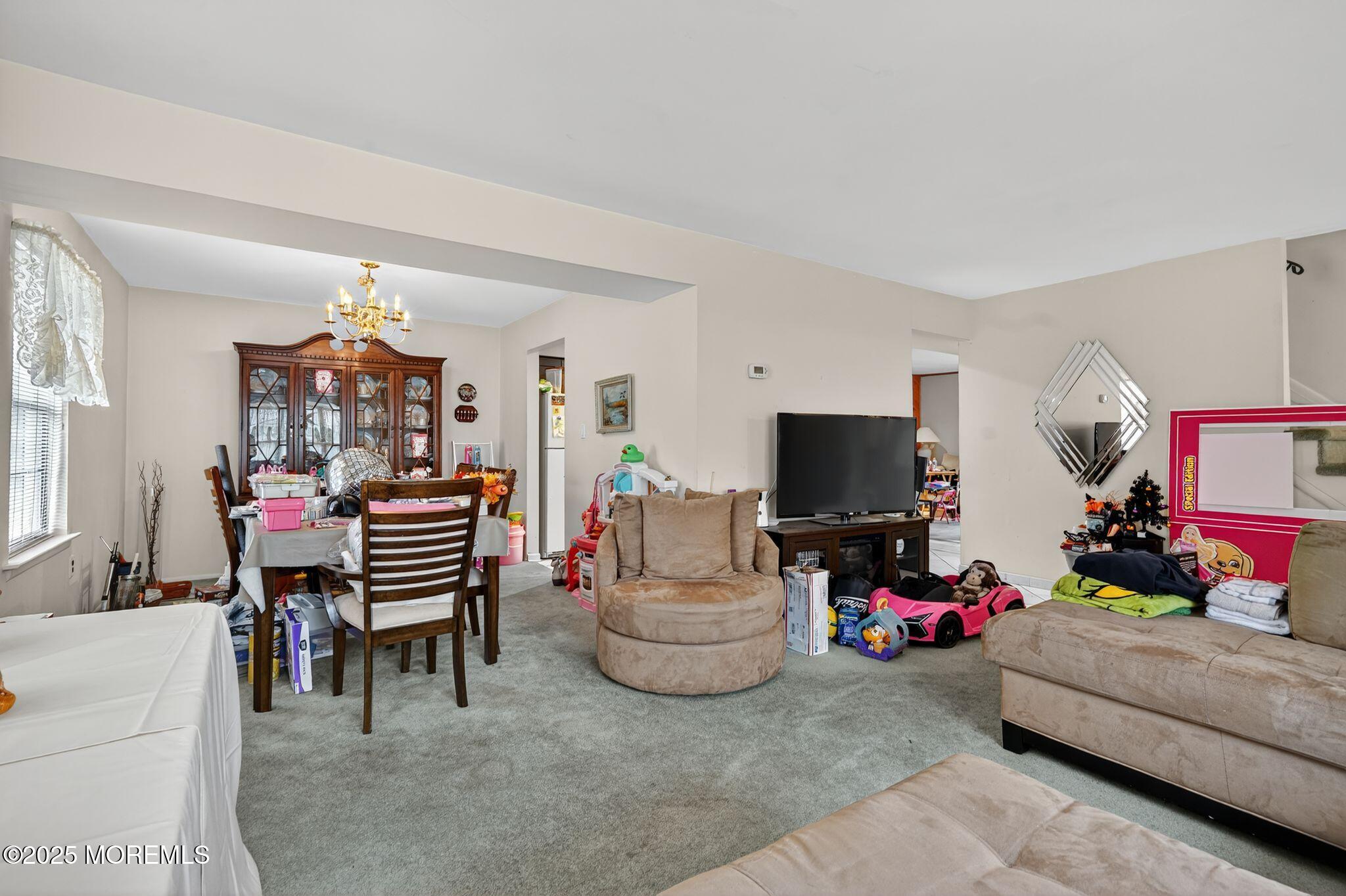 3 Timberline Drive Howell, NJ 07731 - Photo 11 of 21 a living room with furniture and a flat screen tv