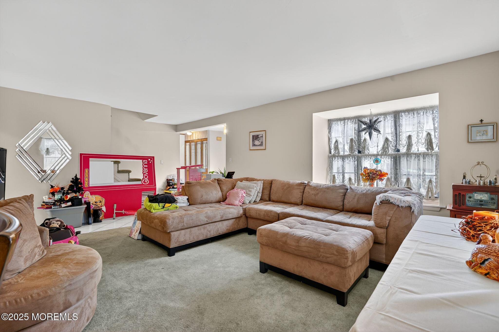 3 Timberline Drive Howell, NJ 07731 - Photo 12 of 21 a living room with furniture fireplace and window
