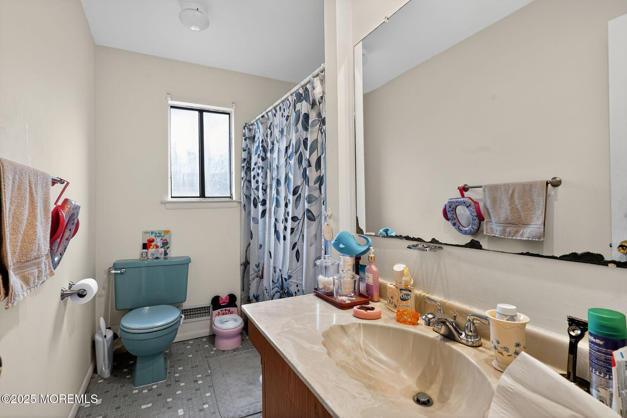 3 Timberline Drive Howell, NJ 07731 - Photo 19 of 21 a bathroom with a sink toilet and a mirror