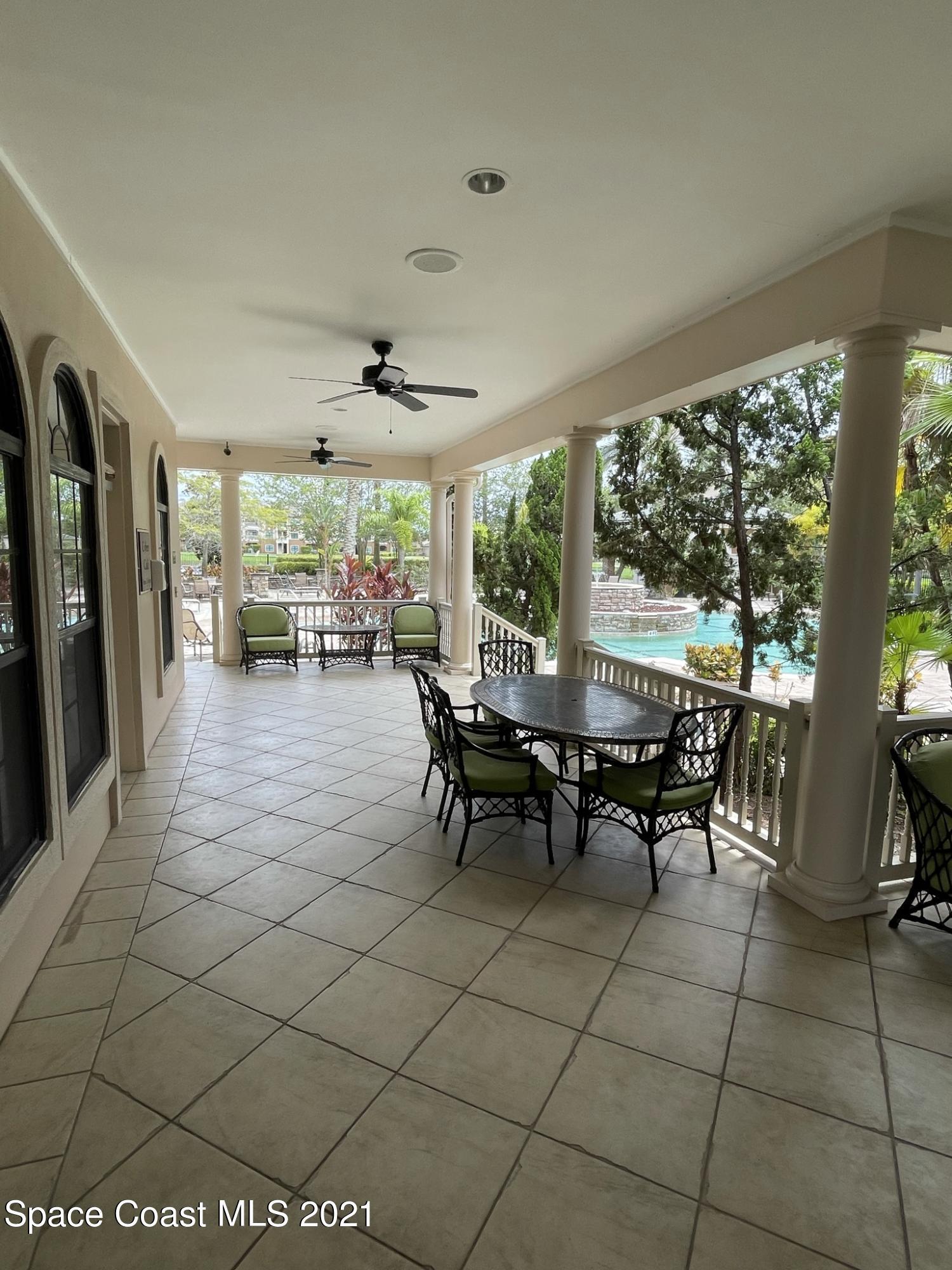 6411 Borasco Drive, Unit 319 Melbourne, FL 32940 - Photo 18 of 27 a view of a dining room with furniture window and outside view