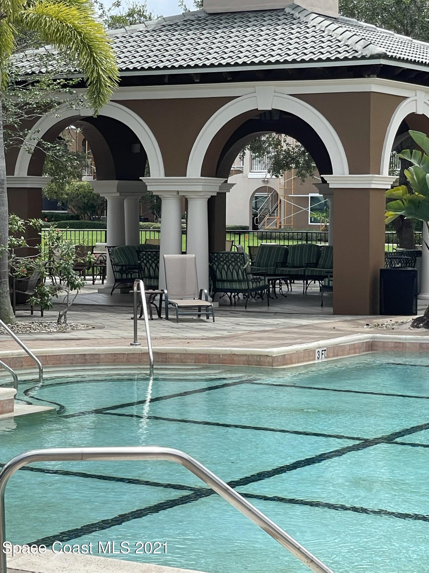 6411 Borasco Drive, Unit 319 Melbourne, FL 32940 - Photo 20 of 27 a front view of house with outdoor space