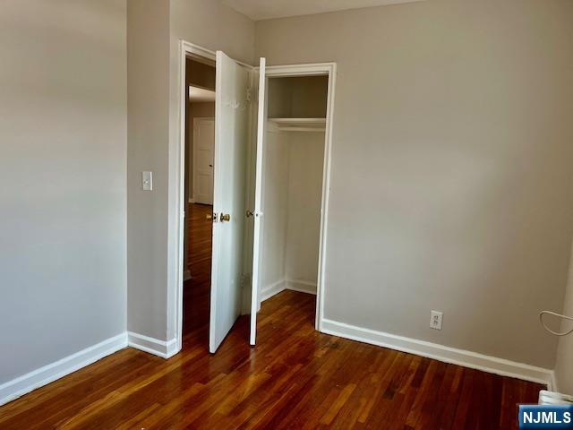 285 Teaneck Road, Unit 285B Ridgefield Park, NJ 07660 - Photo 11 of 12 an empty room with wooden floor and closet